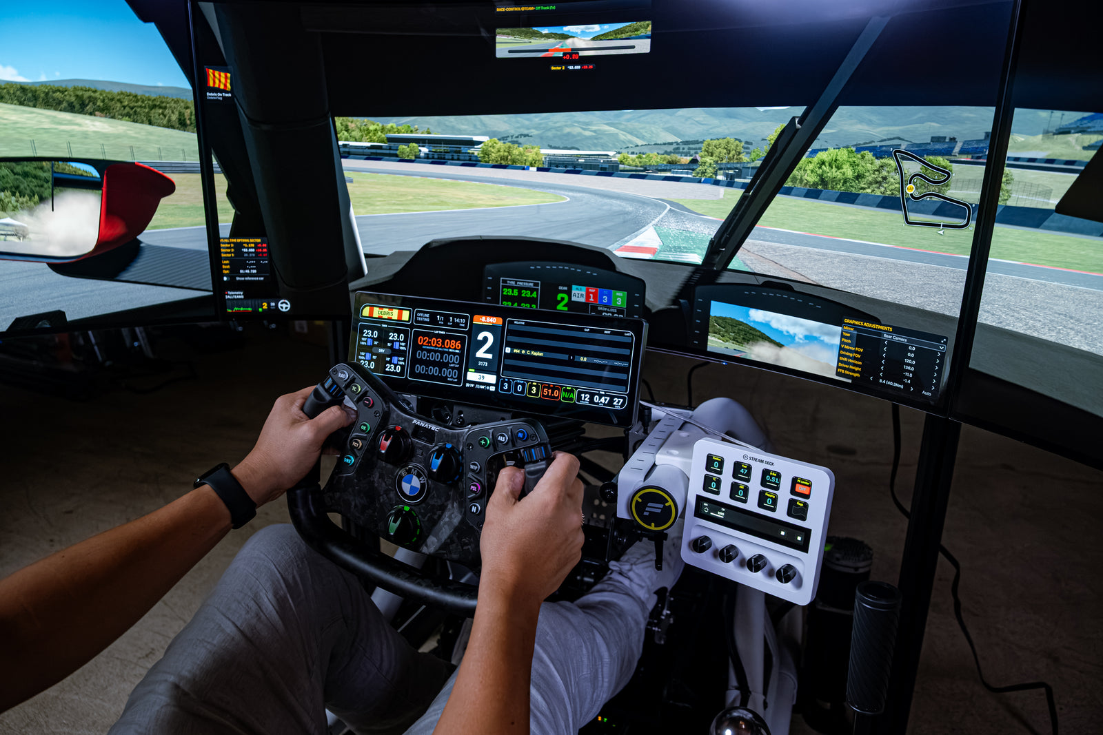 Driver hands on the Podium wheel in the Formula Motion